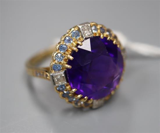 An 18ct yellow gold, amethyst, sapphire and diamond dress ring, with claw-set basket mount, size N, gross 7.5g